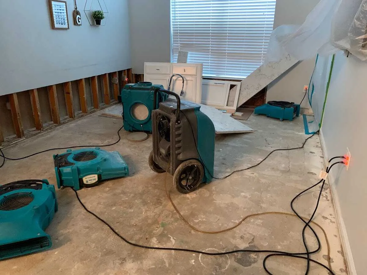 Dehumidifier in flood-cut room for Water Damage Restoration in Port Townsend